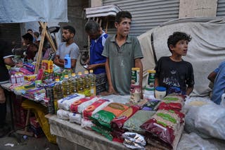 Palestinian vendors display goods for sale at a street market in Gaza City